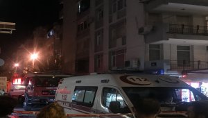 İzmir'de pencereden sarkarak polise direnen cezaevi firarisi ikna edilerek teslim oldu